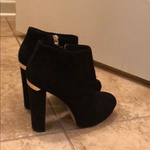 Michael Kori short boot with high heel.